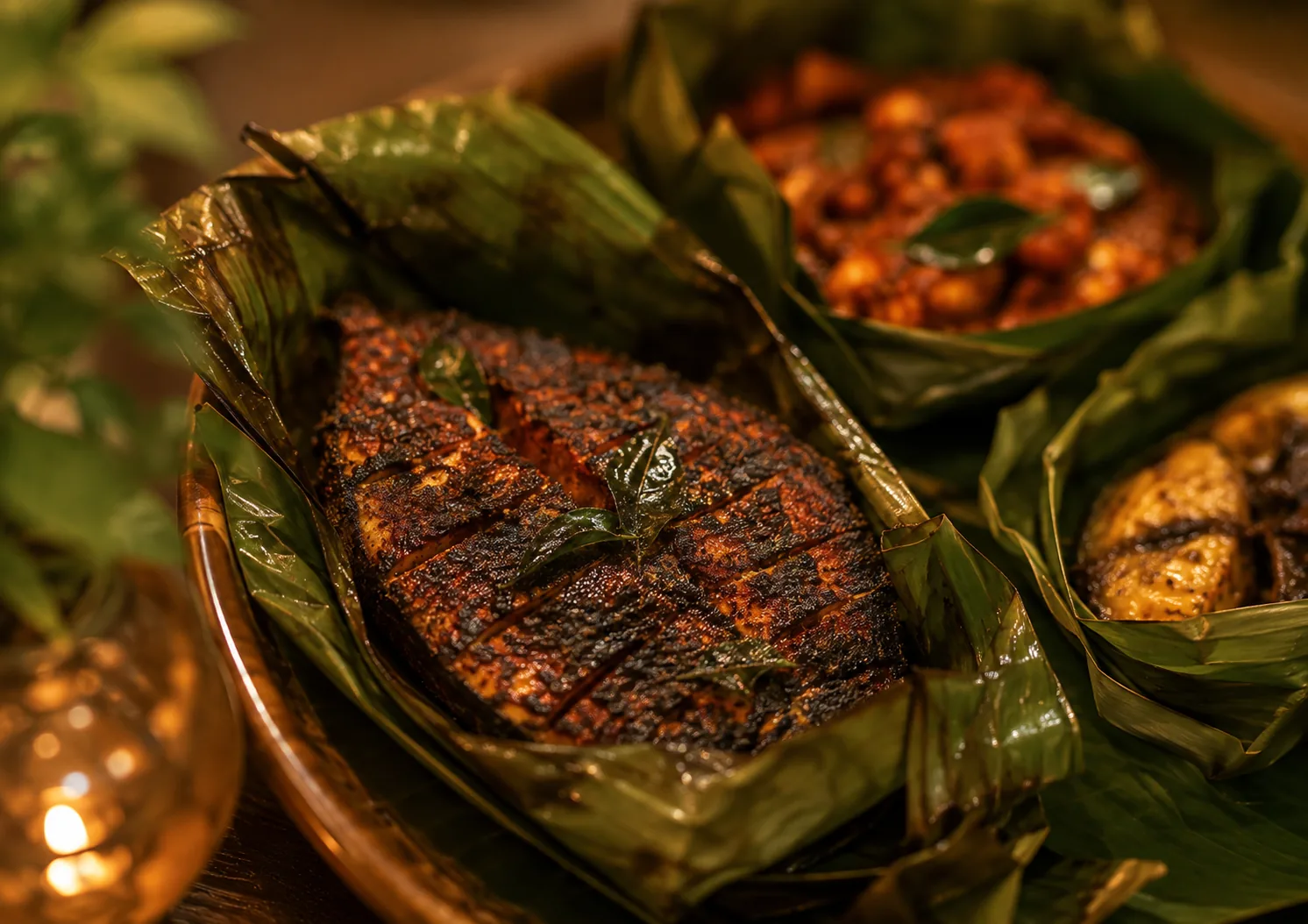 Malabar seafood, banana-leaf grilled fish and curry, at Othayoth Villa, Kannur