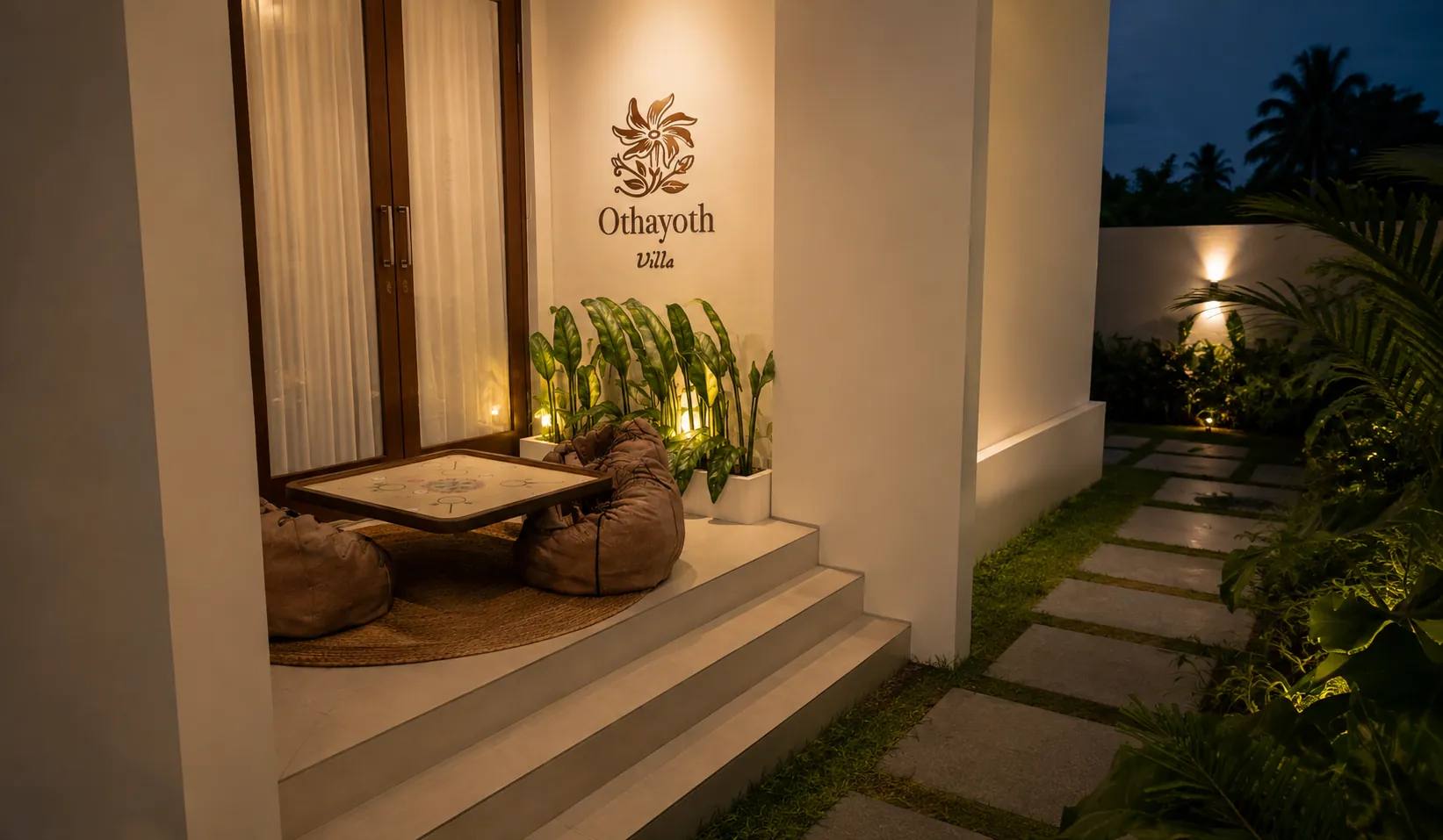Private evening sitout with low seating at Othayoth Villa, Kannur